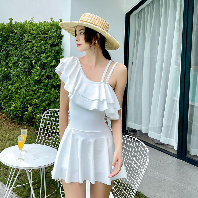 Women’s skirted swimsuit with ruffle detail and feminine silhouette